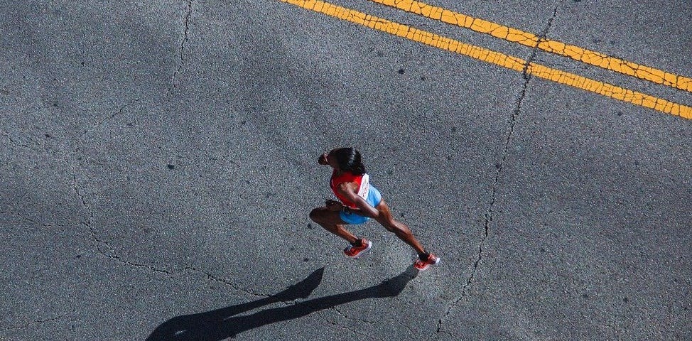 woman running a race