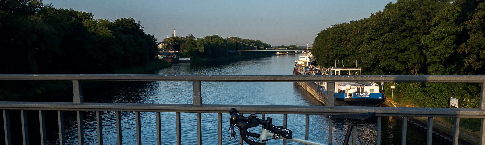 View over the Rhein-Herne canal near the lock Gelsenkirchen — nearly the halfway point of a relaxed 50 km route that guided me through five cities. Gelsenkirchen, Germany, May 28, 2023.
