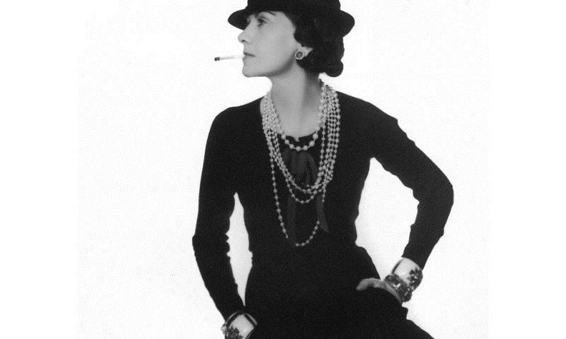 Chanel 1926 in Black Dress, pearls, smoking cigarette