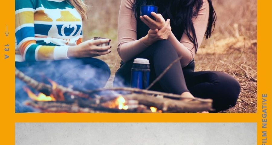 Women sitting near a camp fire, a woman staring at screen like, “what?”