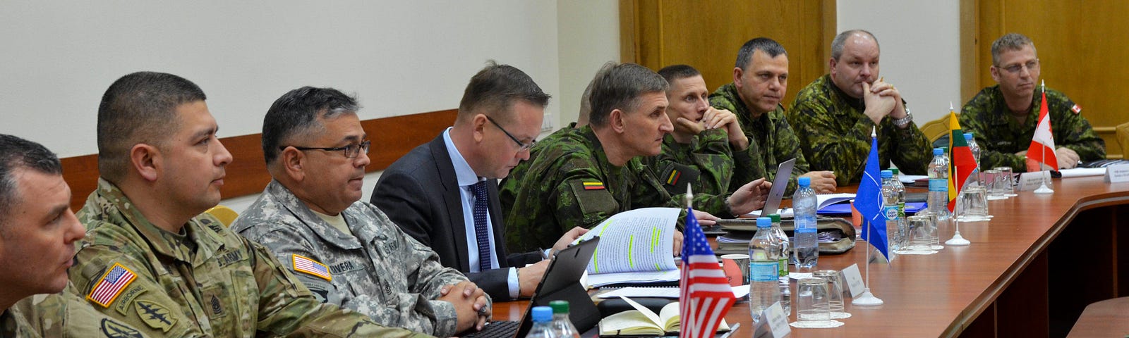 Representatives from the United States, Canada, Lithuania, NATO, and Ukraine discuss the noncommissioned officer development-training course at the Office of Defensive Cooperation in Kyiv, Ukraine, February 24, 2016. Photo by Staff Sgt. Adriana M. Diaz-Brown/U.S. Army