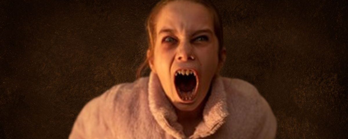 A vampire girl screams at us.