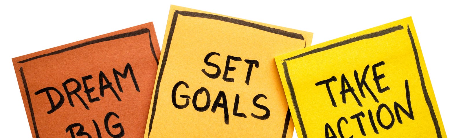 Sticky notes with inspirational quotes for an article about setting SMART goals this new year.
