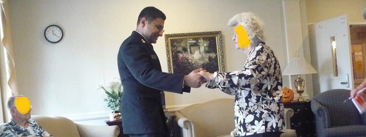 A picture of me in my naval uniform, dancing with one of the ladies at the nursing home.