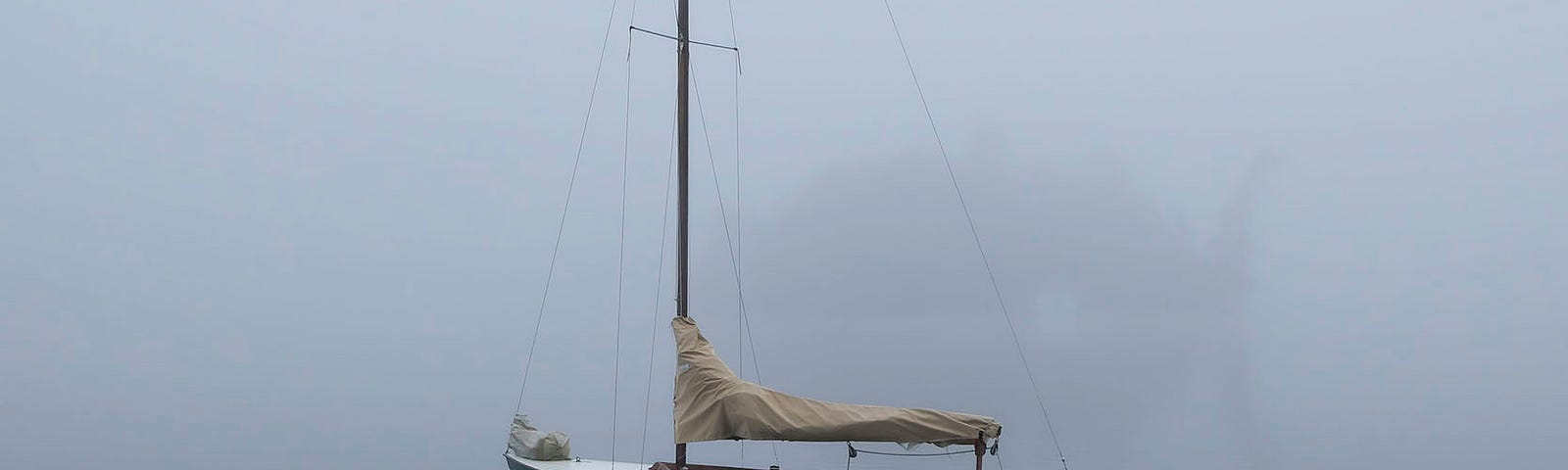 a sailboat in the fog