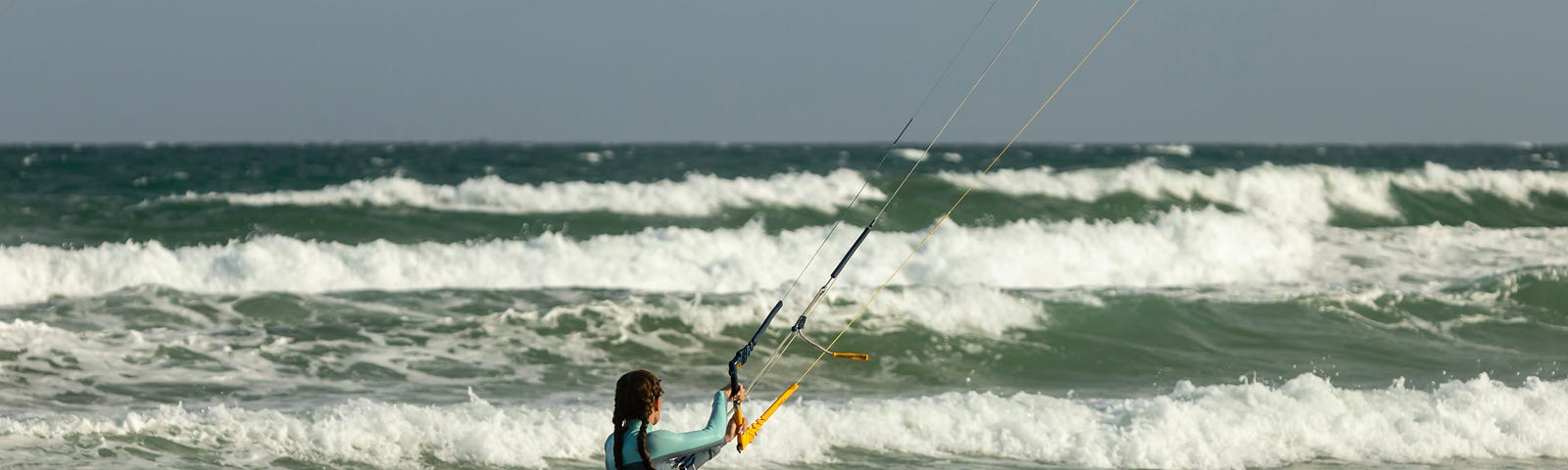A kite surfer enjoying the ocean waves