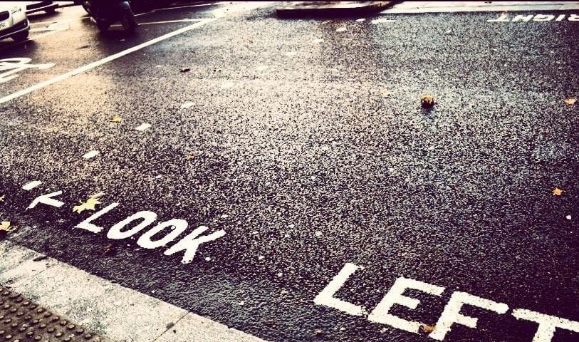 Photo of Look Left warning on London street.