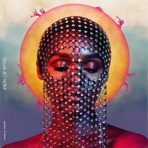 The face of Janelle Monae, a Black woman, with her eyes closed. She wears a piece of chainmail draped over her face and a sun is painted behind her head as a halo. The painting blends the style of religious art and sci-fi/fantasy imagery. The album title “Dirty Computer” is on the left side.