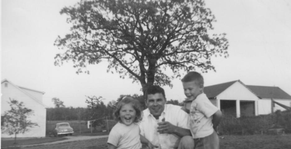 Vintage family photo of dad and two young children in late 1950s