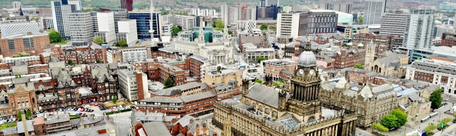 Aerial view of Leeds city centre with the Town Hall in the front right