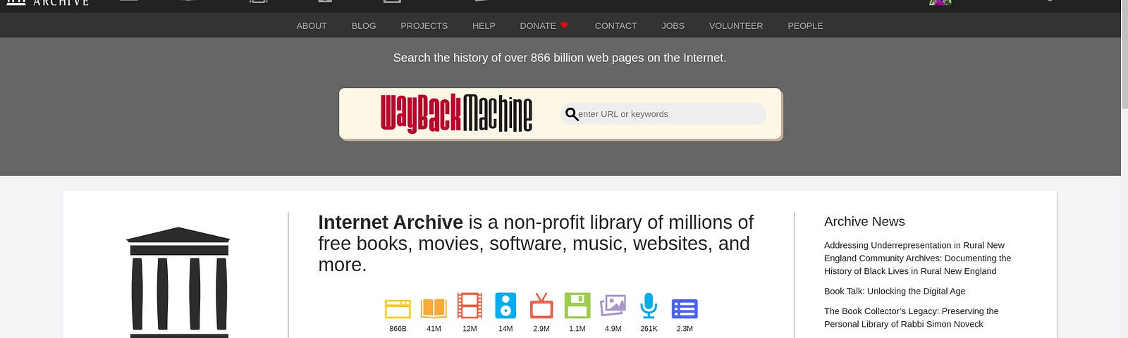 Displayed on the screen is the homepage of the Internet Archive with a focus on the Wayback Machine search bar. Below the search bar, an explanatory text mentions that Internet Archive is a non-profit library of books, movies, software, music, websites, and more, along with icons representing these media types.