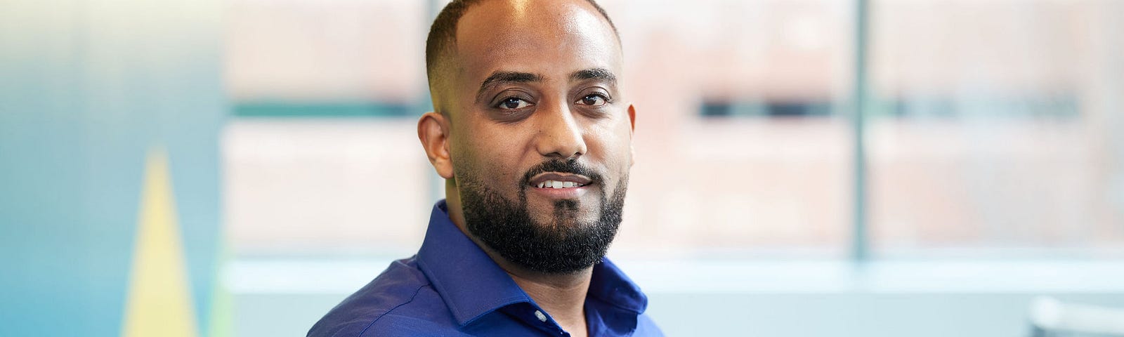 Yonas Mekonnen smiles at camera.