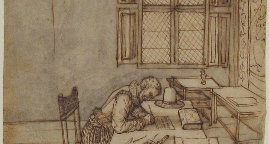 A man writing at his desk