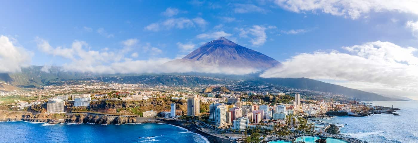 View of Puerto de la Cruz with the Mount Teide in the back, Tenerife. Getty Images.