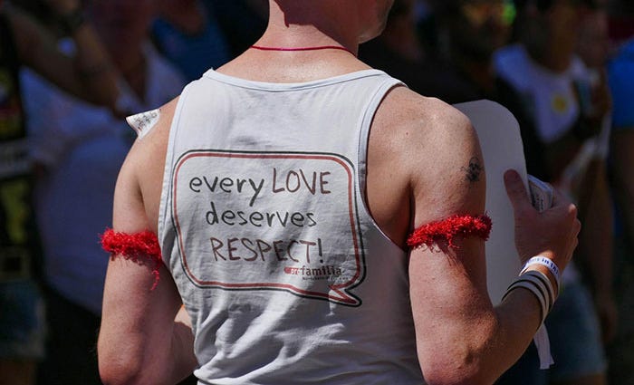 Man wearing a shirt which reads: every LOVE deserves RESPECT!