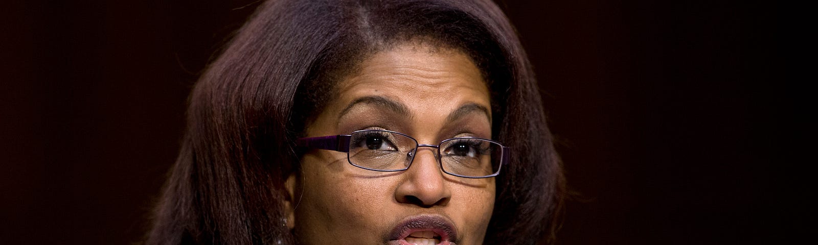 BriGette McCoy, former specialist in the U.S. Army, testifies before a Senate Committee on Armed Services hearing on sexual assault in the military in March 2013. Photo by Carolyn Kaster/AP Images