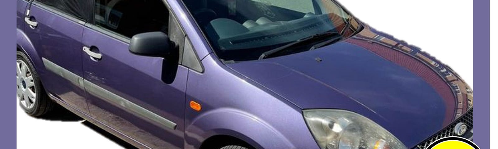 A photograph of the Purple Ford Fiesta we are getting, it has a smiley face over the number plate for privacy reasons.