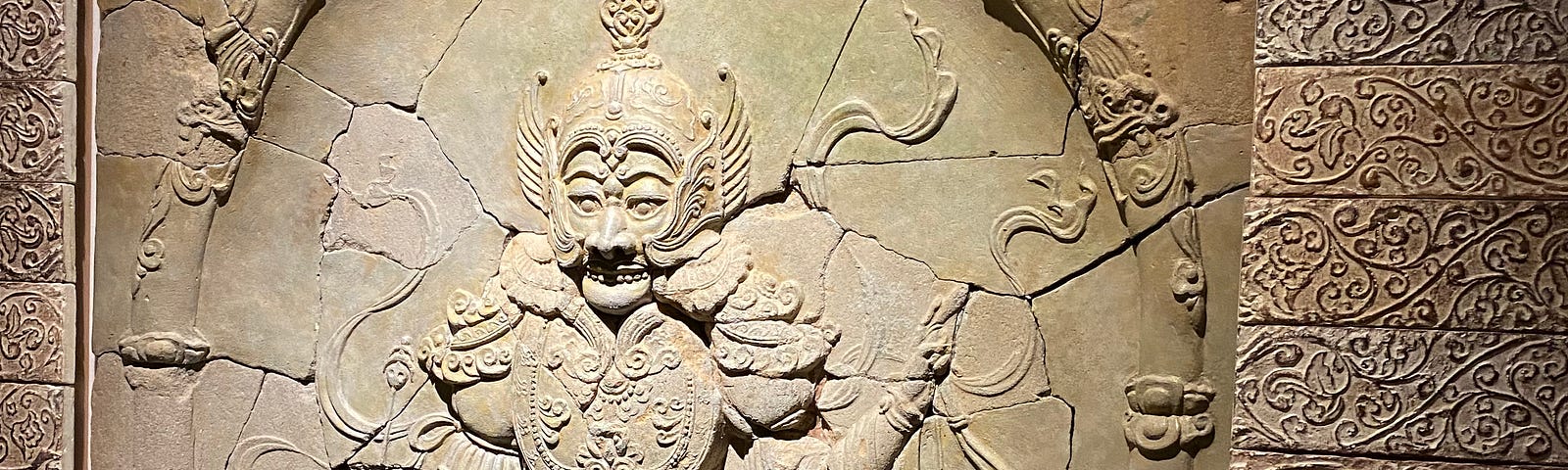 A stone relief of a warrior figure. Picture taken by the author.