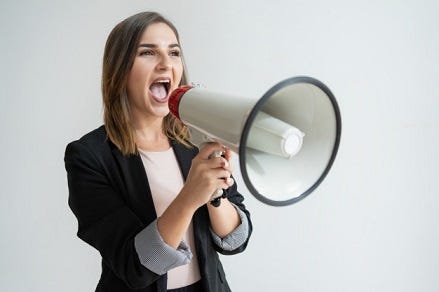 A picture of a woman shouting into a megaphone.