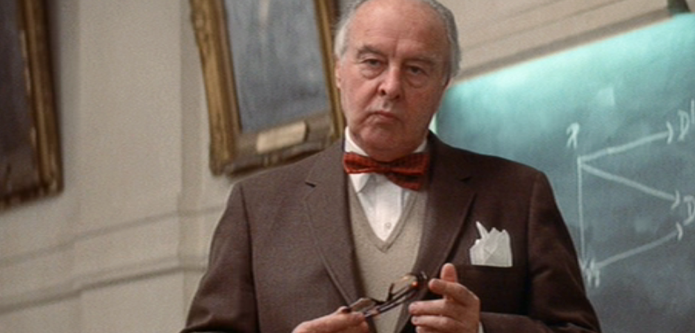 A photo of actor John Houseman standing in a classroom playing Professor Charles Kingsfield in the movie The Paper Chase.