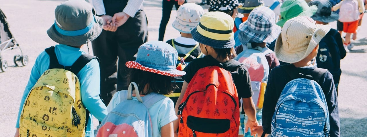 A group of young children walking together