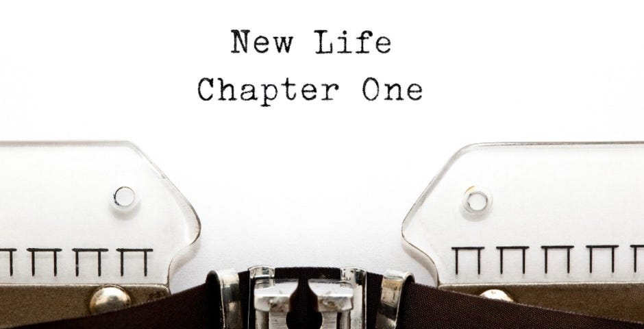 A typewriter and typing that says: NEW LIFE CHAPTER ONE.