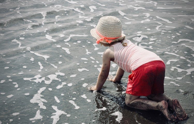 You are never ready to have kids — A girl crawling at the seashore