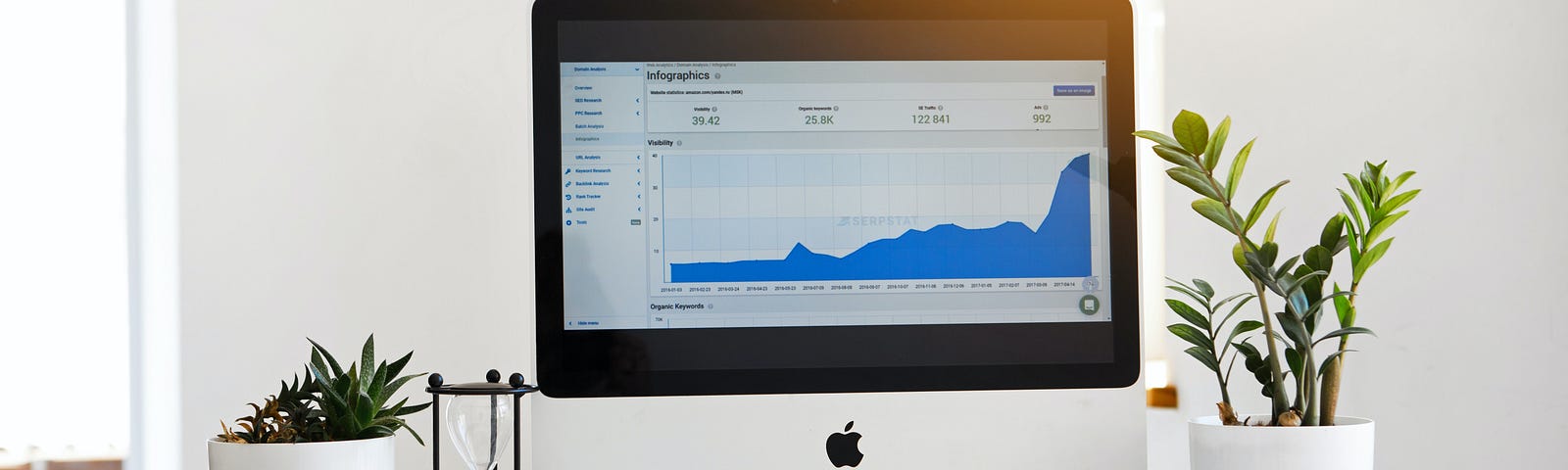 computer with chart showing rising numbers better stats