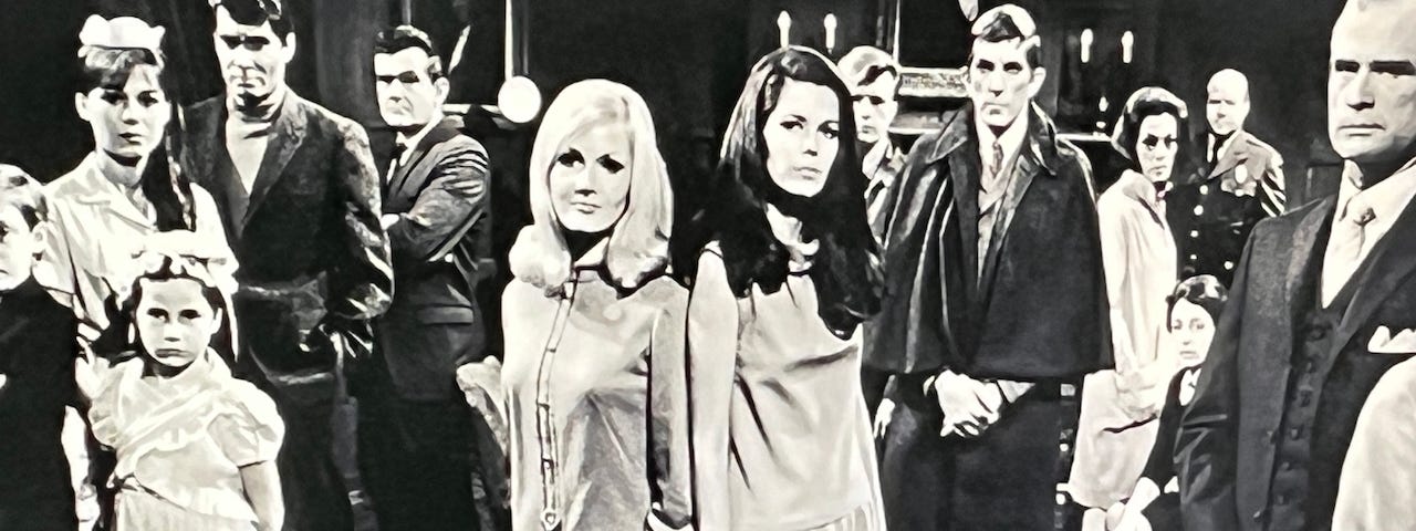 Multiple characters stand in the main room of the mansion of Dark Shadows. Gothic horror, vampire, culture, series, television, nostalgia