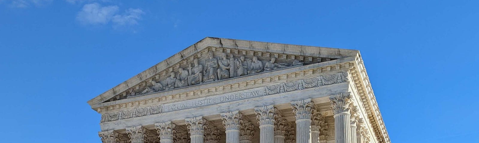 Front view of the U.S. Supreme Court building with steps and plaza in foreground
