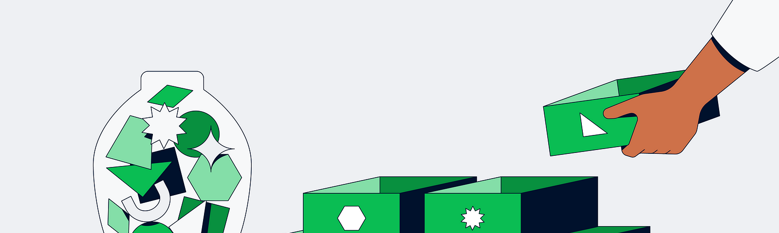 6 green boxes stack together; each box is labelled with different shapes. Beside these boxes, a transparent container filled with different shapes.