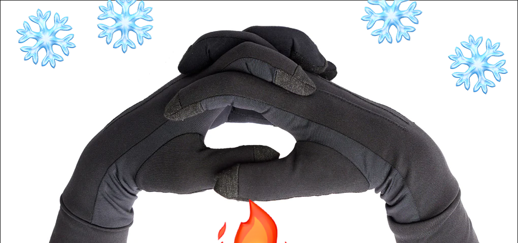 A pair of The Writer’s Glove. with snowflakes falling on it and a flame between the gloves.