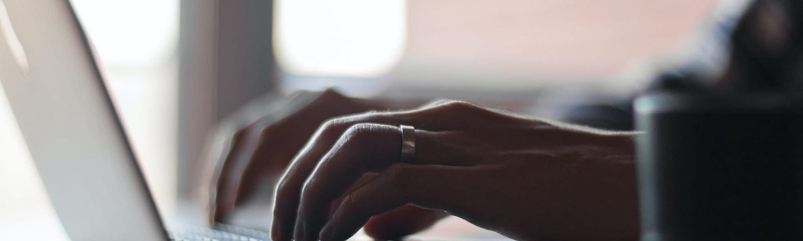 person typing on laptop