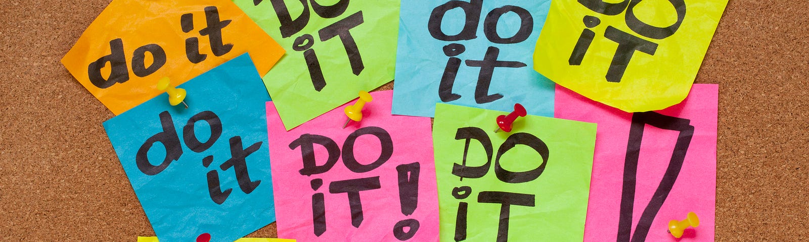 Post-it notes with the phrase “Do it” on a bulletin board