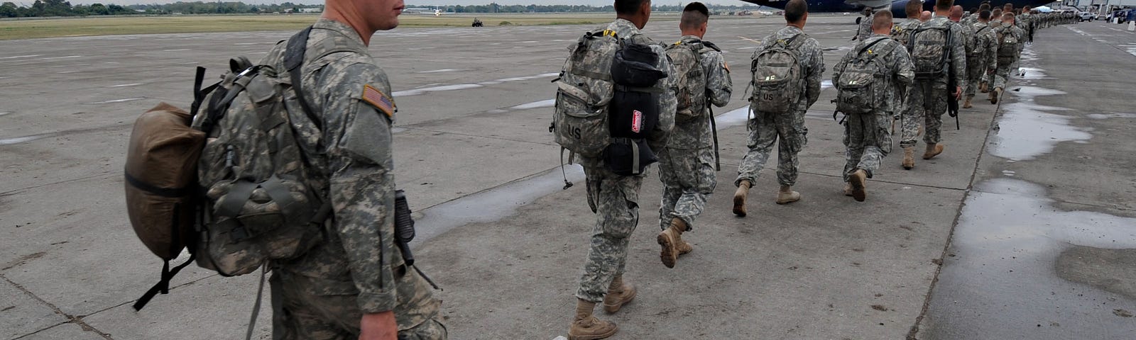 Soldiers assigned to the 82nd Airborne Division board a plane to return to Fort Bragg, North Carolina, March 6, 2010. U.S. Army photo