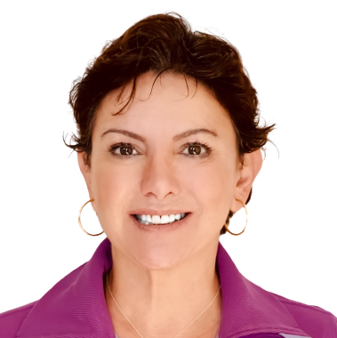 Woman with short brown hair, brown eyes, hoop earrings, and a berry-colored collar smiling at the camera