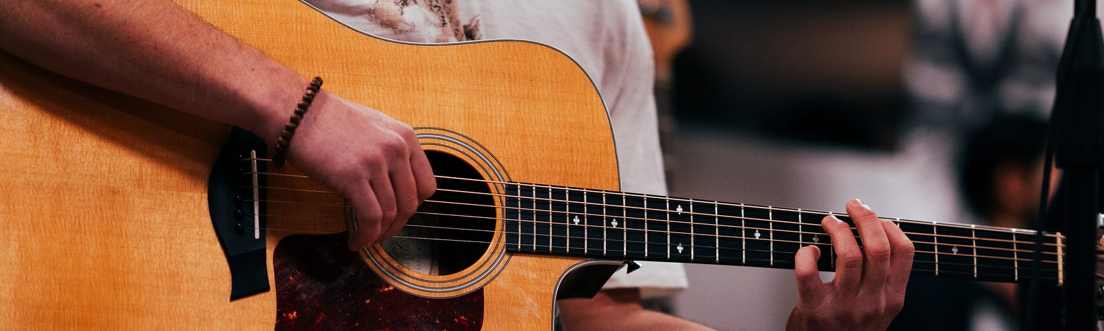 An acoustic guitar in my hands.