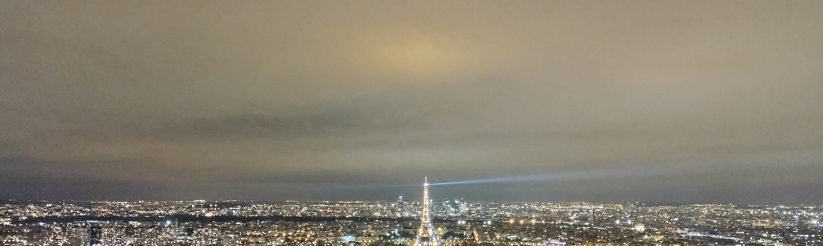 A view of the Eiffel Tower at night, taken from Tour Montparnasse.