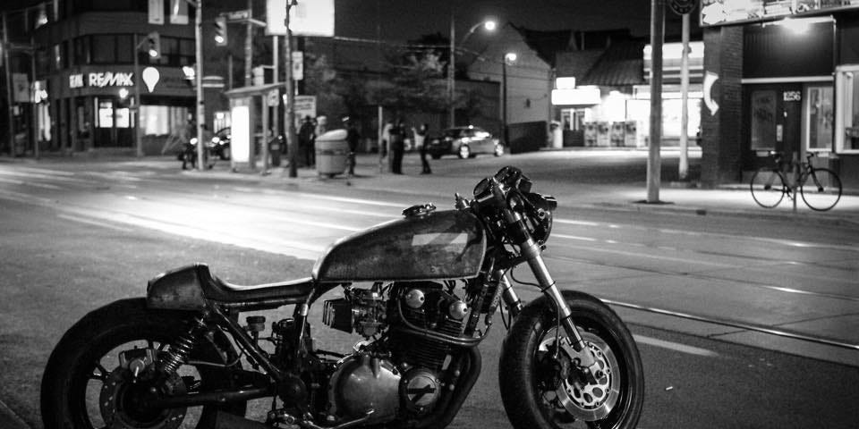 A motorcycle parked on the street at night