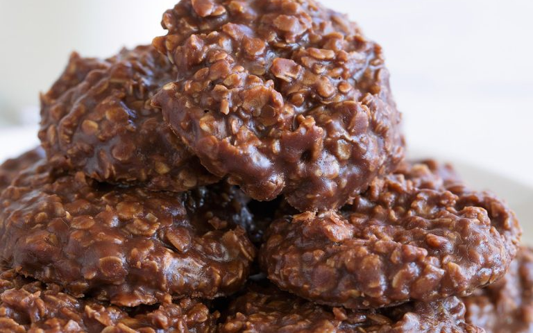 A photograph of a pile of chocolate oatmeal cookies.