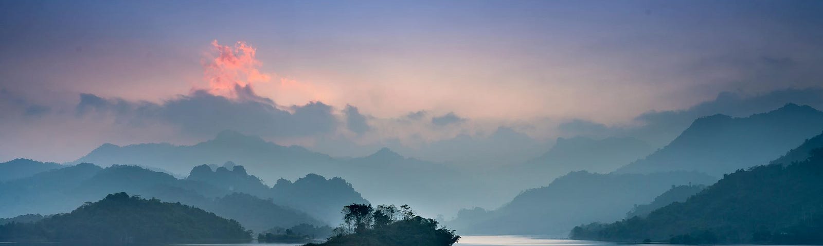 A misty lake among mountains.