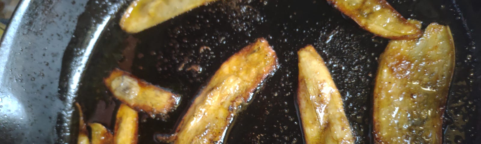 banana peels cooking in cast iron pan