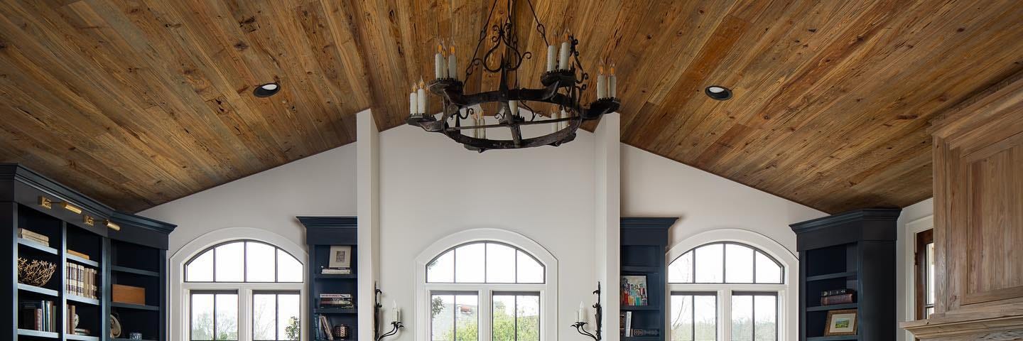 Reclaimed wood vaulted ceiling in Family Room with fireplace