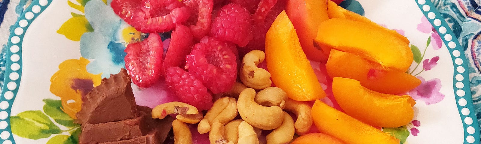 Nectarines, raspberries, cashews and keto fat bomb for my lunch! Image © Milli Thornton