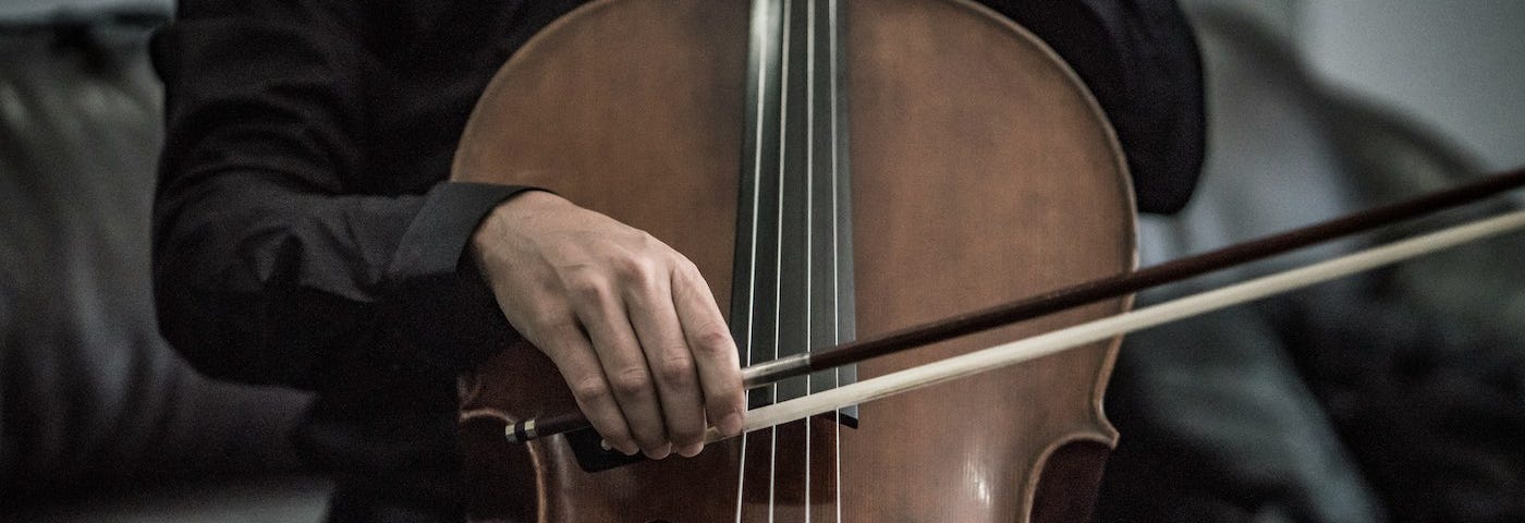 A cello being played with a bow