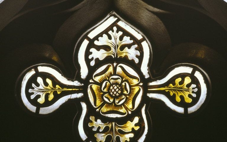 Stained glass window with yellow flower in the centre