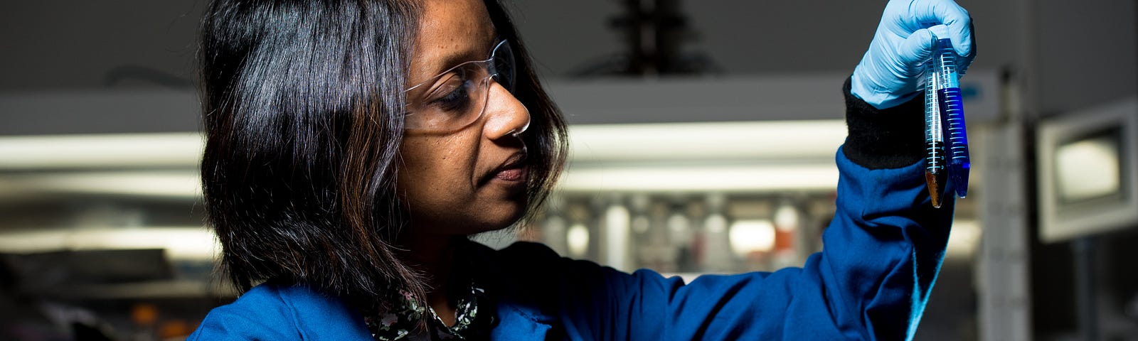 women holds test tube