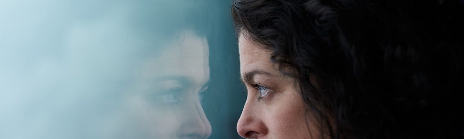 Alexei Maridashvili took this photo of a young woman looking at her reflection in the window.