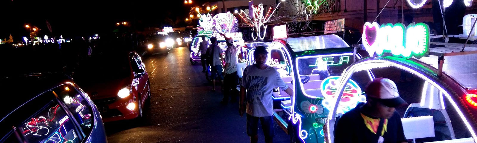 Neon pedal cars built and rented by young entrepreneurs in Yogyakarta Indonesia