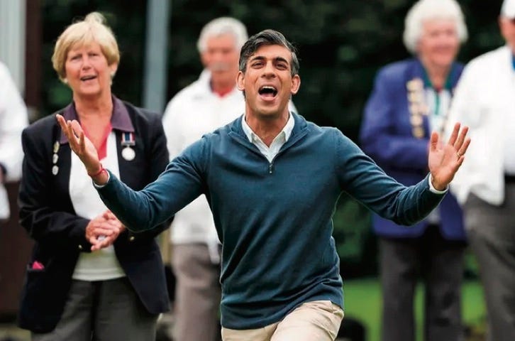 photo of Rishi Sunak gesturing with his arms